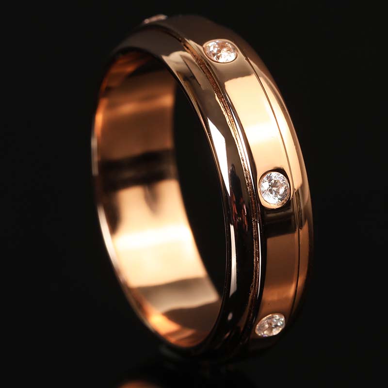 7 Moissanite Stones Spinner Fidget Ring in Rose Gold Finish on Black Background by Calmfor