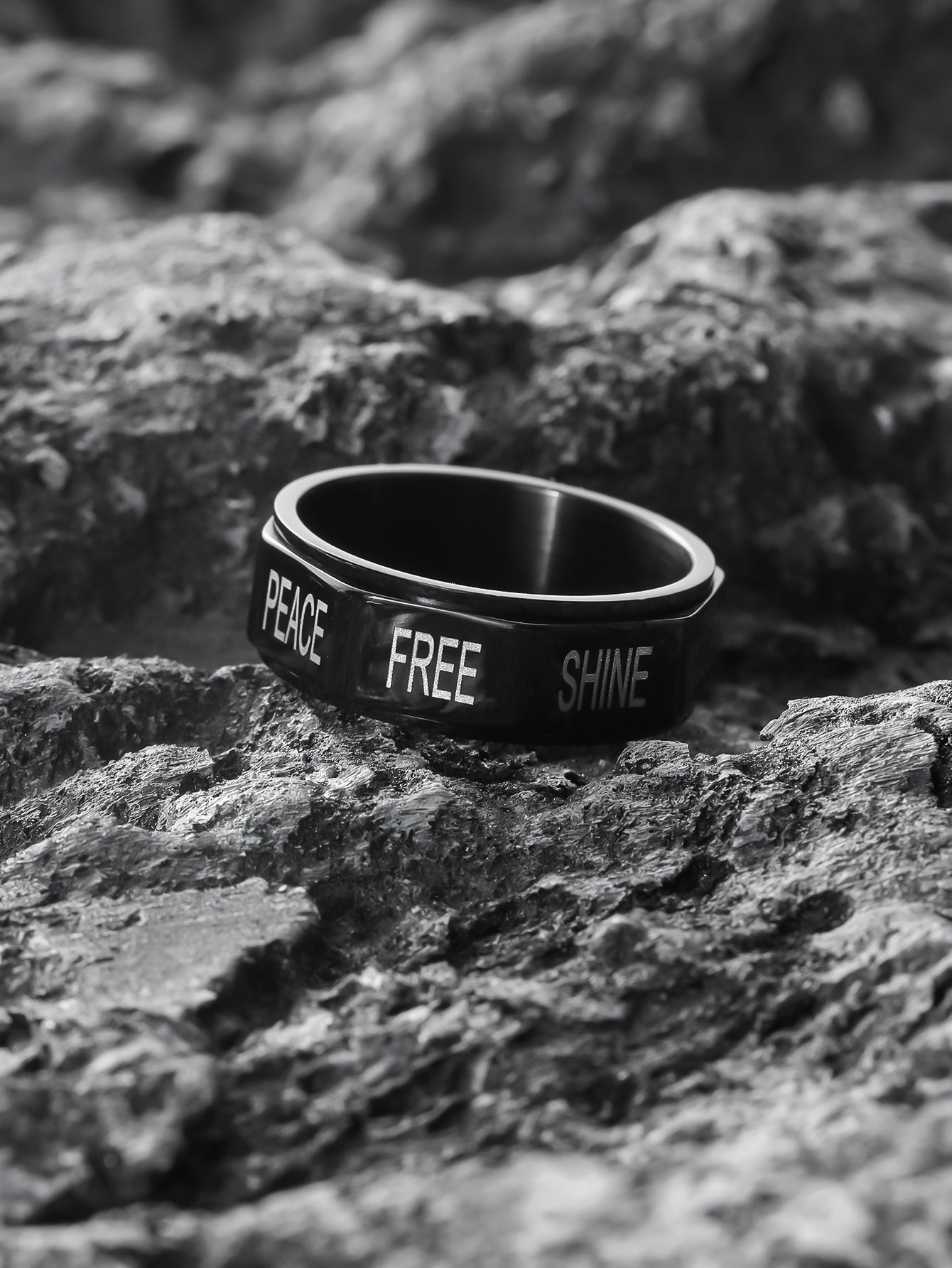 this positive spinner ring is lying on the rock