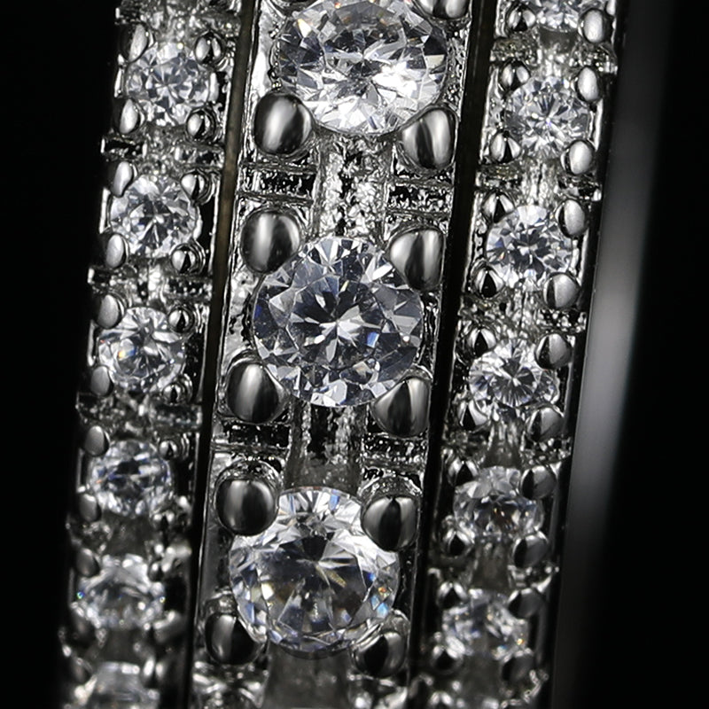 Close shot of this Iced Out 3-Row Spinner Ring WG