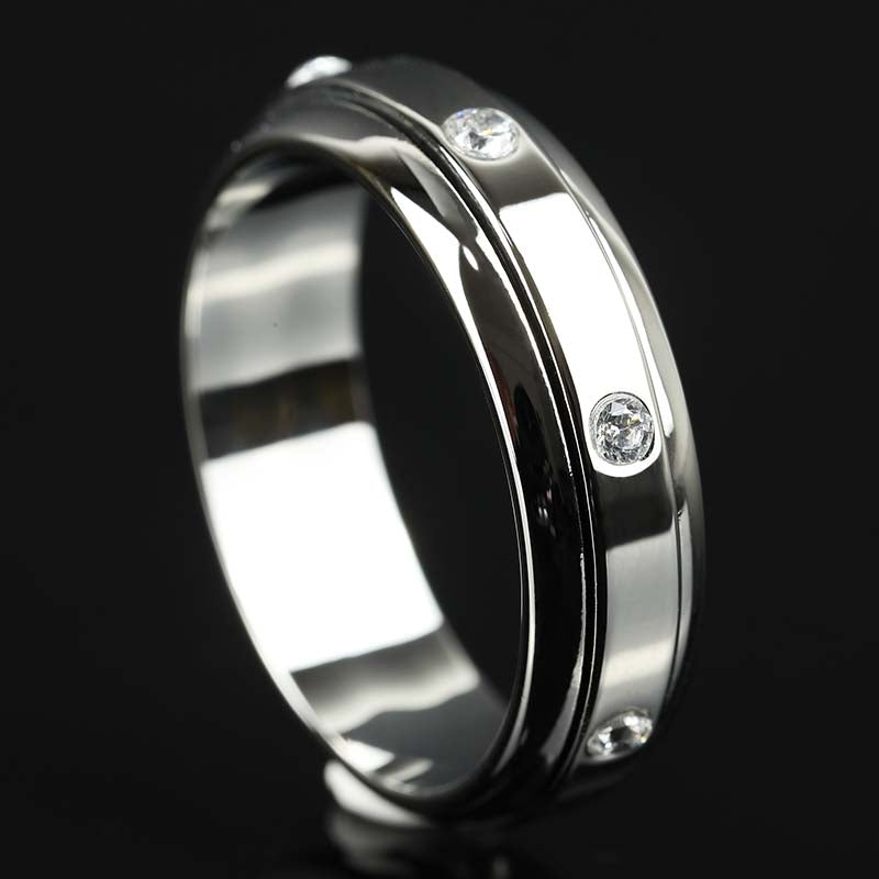 7 Moissanite Stones Spinner Fidget Ring in White Gold Finish on Black Background by Calmfor