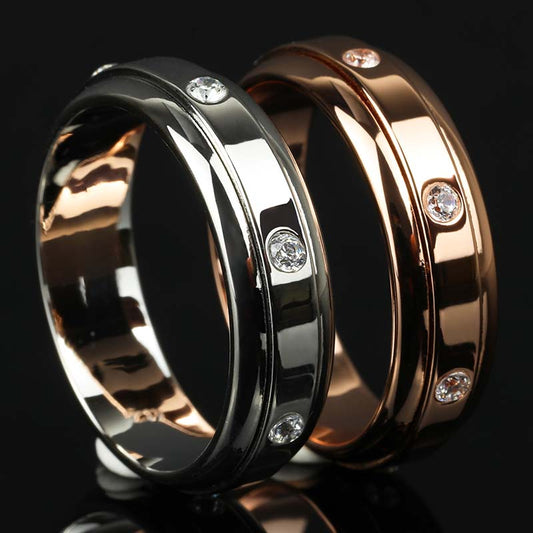 7 Moissanite Stones Spinner Fidget Ring in White and Rose Gold Finish on Black Background by Calmfor