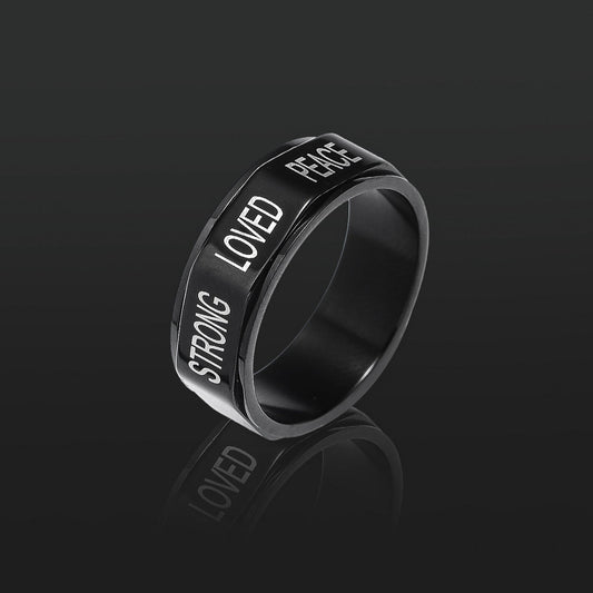 This black encouragement spinner ring in the dark