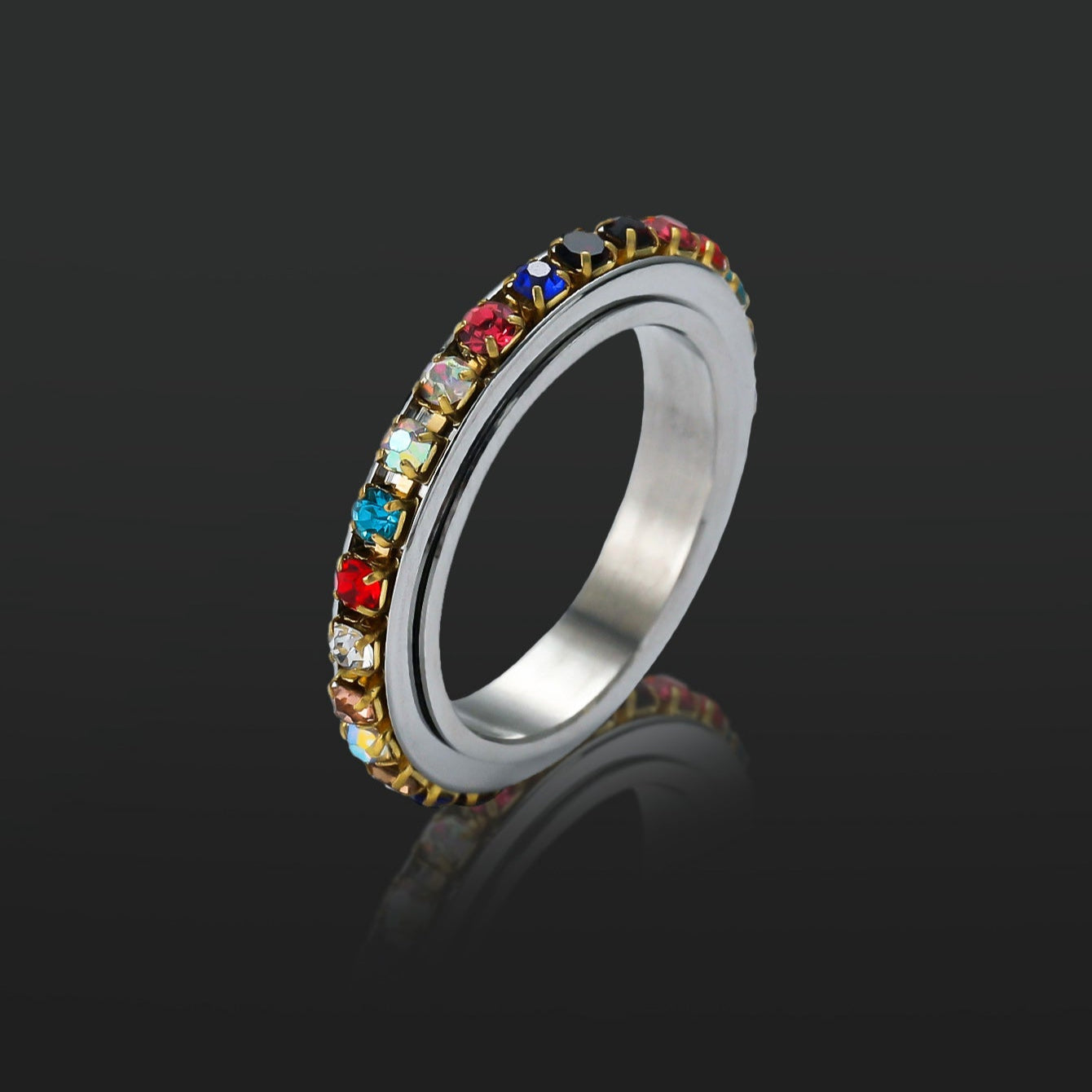 Chakra Spinner Fidget Ring on black background - Calmfor Anxiety relief jewelry