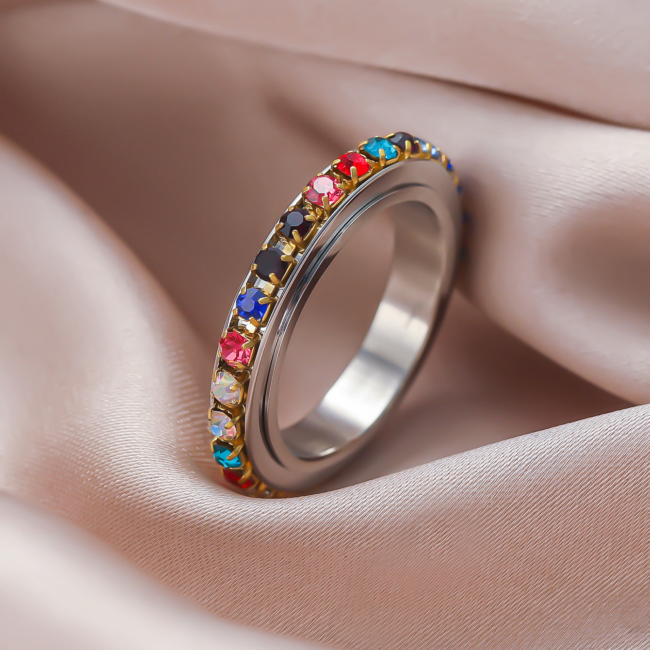 Close-up of Chakra/Rainbow Spinner Fidget Ring, colorful crystal shine and energy flow