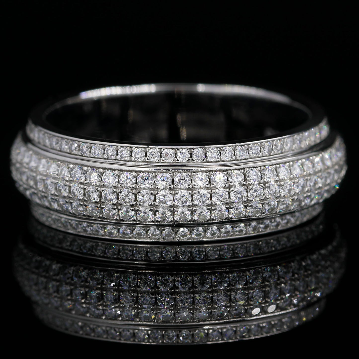 Flat Lay of Iced Out Moissanite Spinner Ring(White Gold finish) on Black Background 