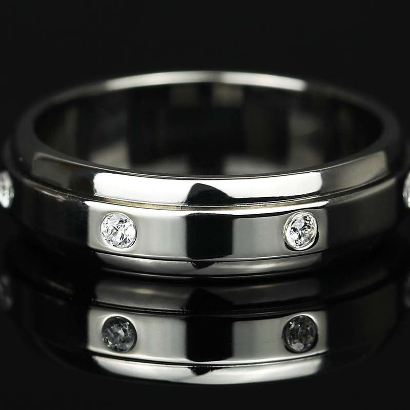 Flat lay of 7 Moissanite Stones Spinner Fidget Ring in White Gold Finish 