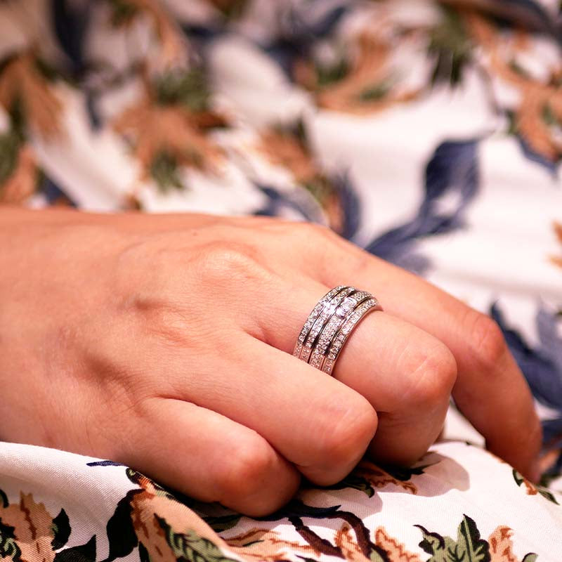 Iced Out Asymmetry Spinner Fidget Ring on a woman's hand
