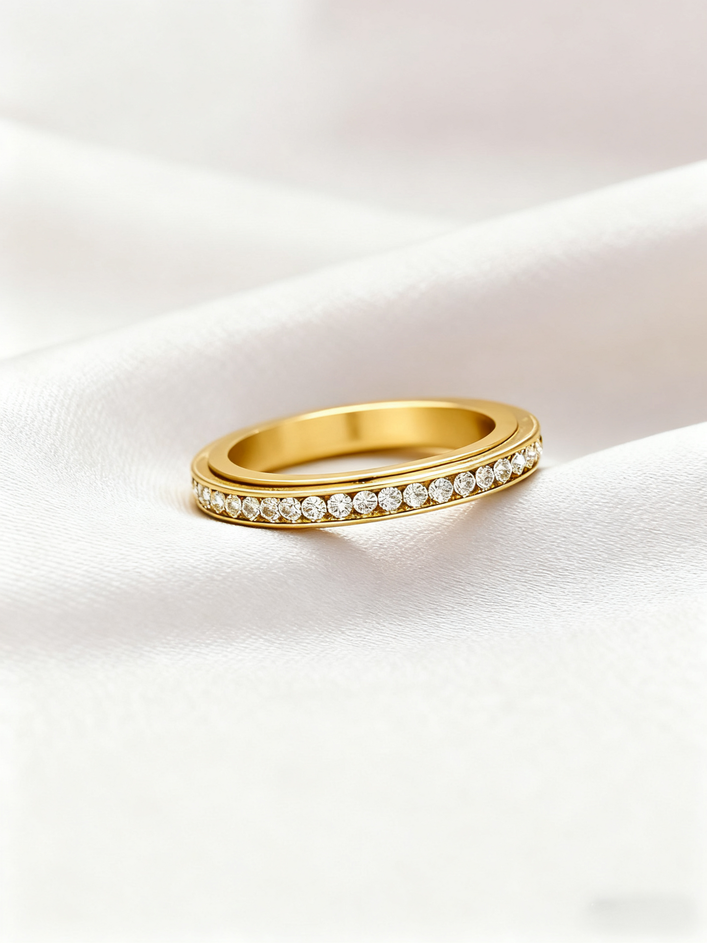 Iced_Out_slim_ring_in_Gold_laying_on_the_velvet2