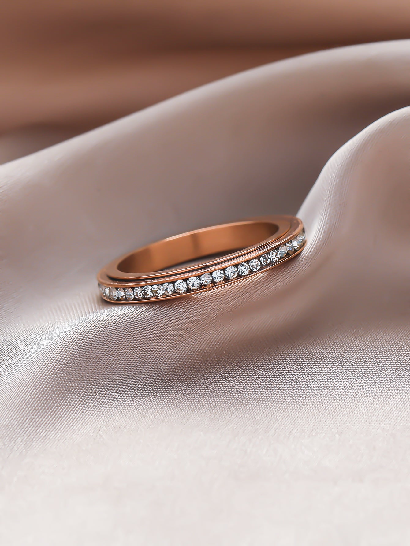 Iced_Out_slim_ring_in_RG_laying_on_the_velvet2