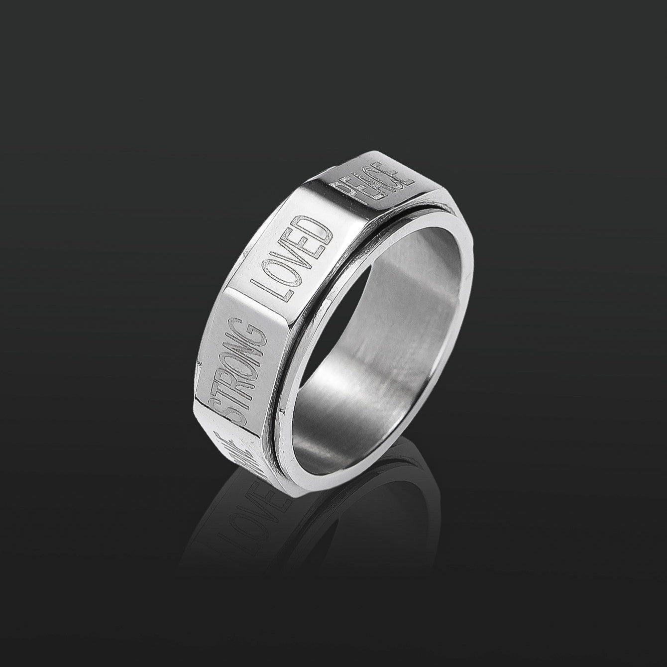 This silver positive words spinner ring in the black backgtound