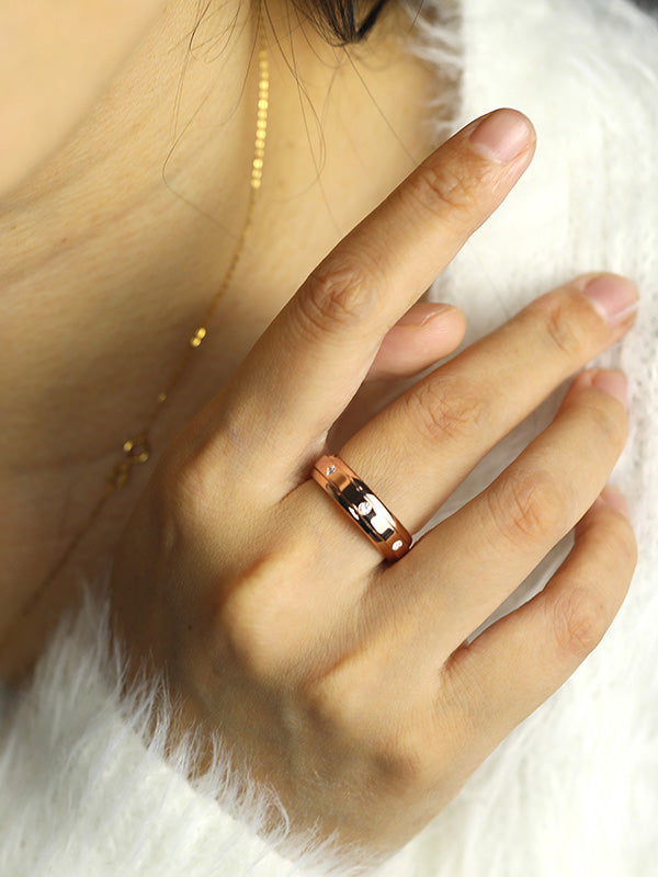 Woman wearing 7 Moissanite Spinner Fidget Ring(Rose Gold finish)