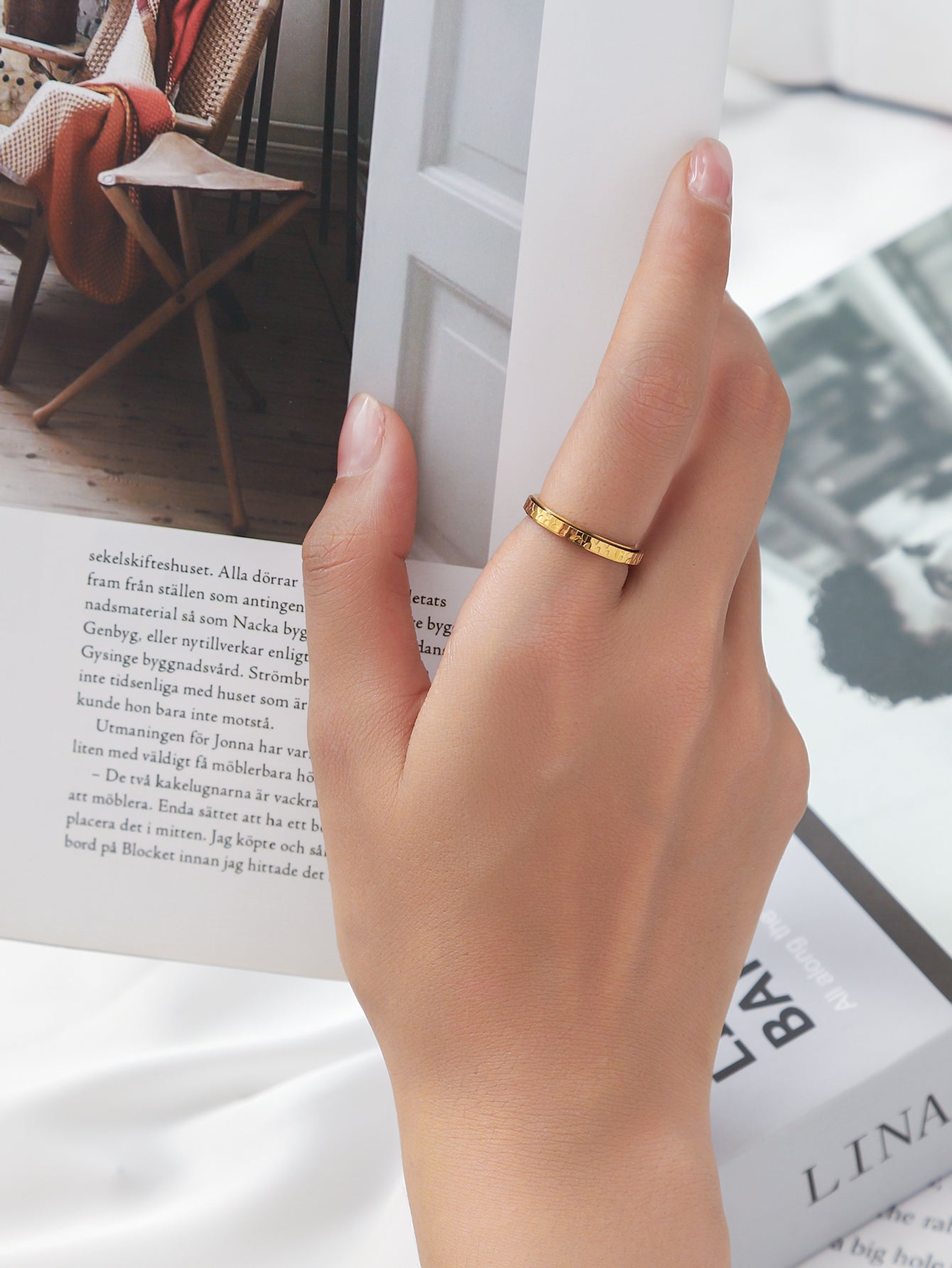 the woman wearing this ring is reading book, it is peaceful time.